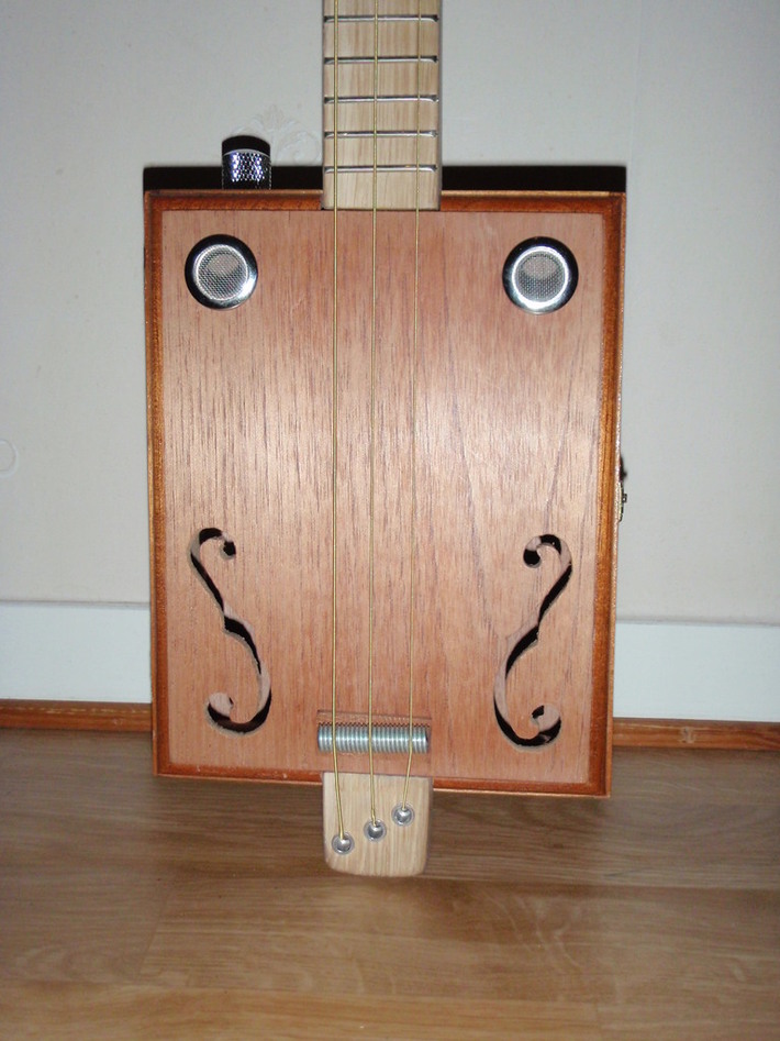 Some pictures of my builds that I made this spring and summer(my first year building genuine cigar box guitar). s)